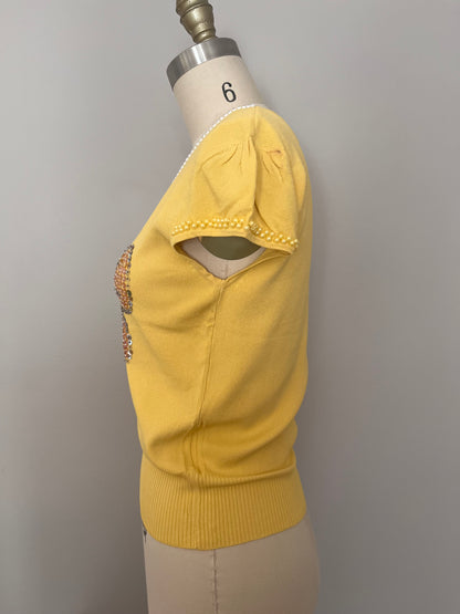 Sequin bow embellished knit top